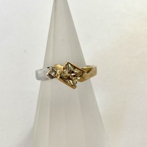 Gold and Silver plated ring with semi bezel set 5mm x 5mm Princess Cut Zultanite (EC = Eye Clean) and a small Diamond.