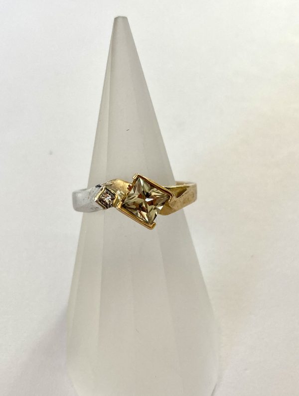 Gold and Silver plated ring with semi bezel set 5mm x 5mm Princess Cut Zultanite (EC = Eye Clean) and a small Diamond.
