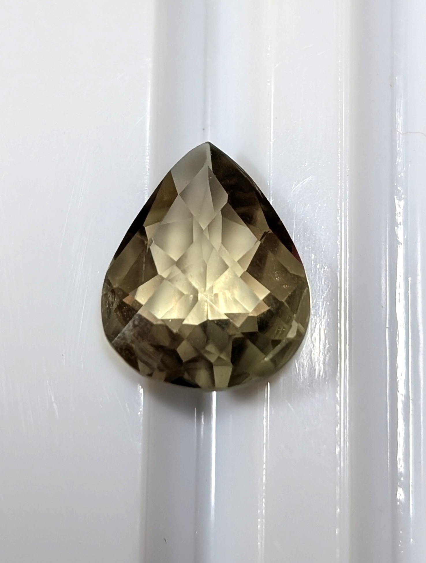Zultanite® Lentil Pear Shape Checkerboard Cut Gemstone, 6.60 carats, MI = Moderately Included.